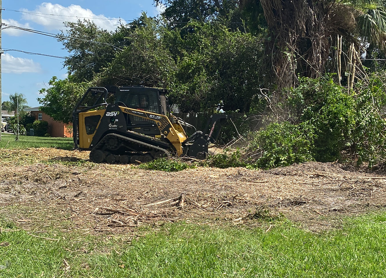 Coastal Mowing & Tree performing land clearing services with their dozer